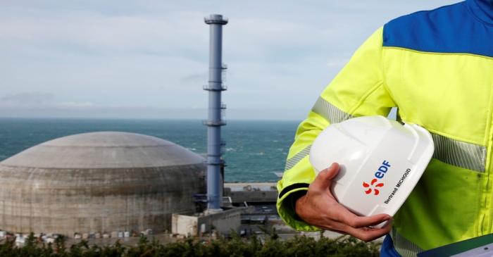 FILE PHOTO: An EDF employee in front of the construction site of the EPR nuclear reactor in