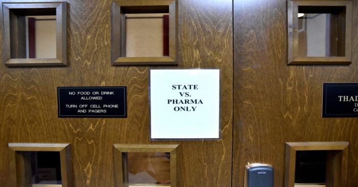 A sign is seen on the outside of the courtroom on the first day of a trial of Johnson & Johnson