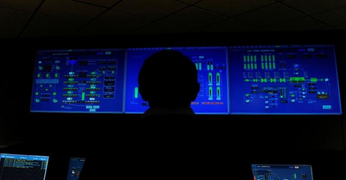 FILE PHOTO: An employee works inside the control room at Drax power station