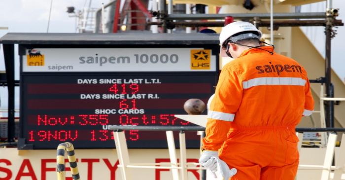 FILE PHOTO: A staff member is seen on the Saipem 10000 deepwater drillship in Genoa's harbour