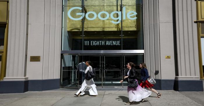 FILE PHOTO: People pass by an entrance to Google offices in New York