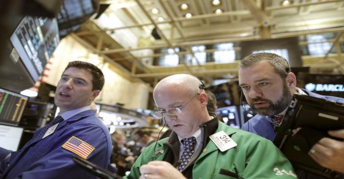 Traders work on the main trading floor of the New York Stock Exchange shortly after the opening