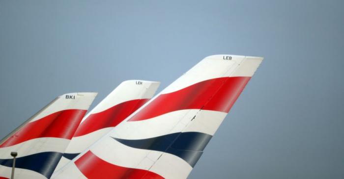 FILE PHOTO: British Airways logos are seen on tail fins at Heathrow Airport in west London