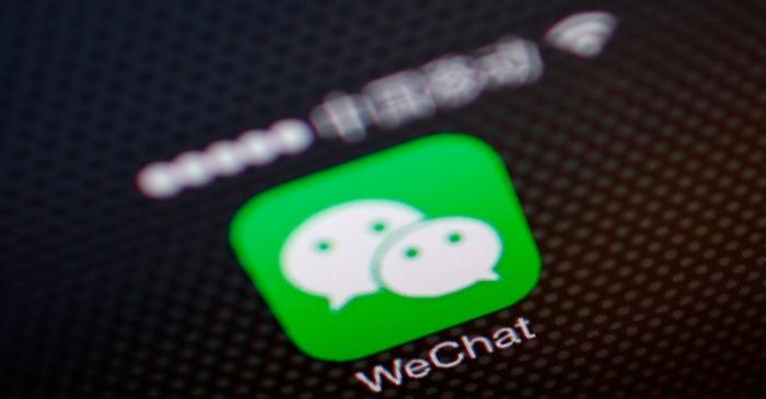 A picture illustration shows a WeChat app icon in Beijing