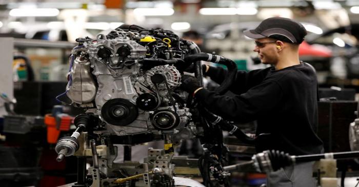 FILE PHOTO: Workers are seen on the production line at Nissan's car plant in Sunderland Britain