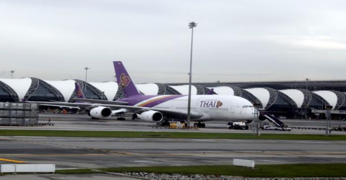 Workers service a Thai Airways aircraft at Bangkok International Suvarnabhumi Airport