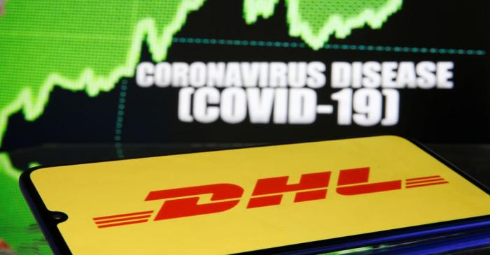 DHL logo is seen in front of diplayed coronavirus disease (COVID-19)