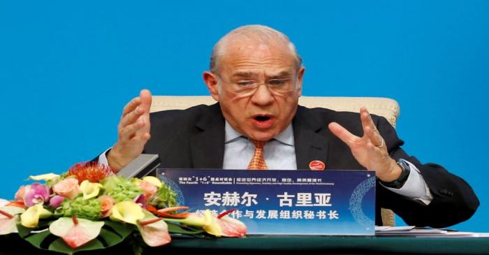 OECD Secretary-General Angel Gurria speaks at a news conference following the 