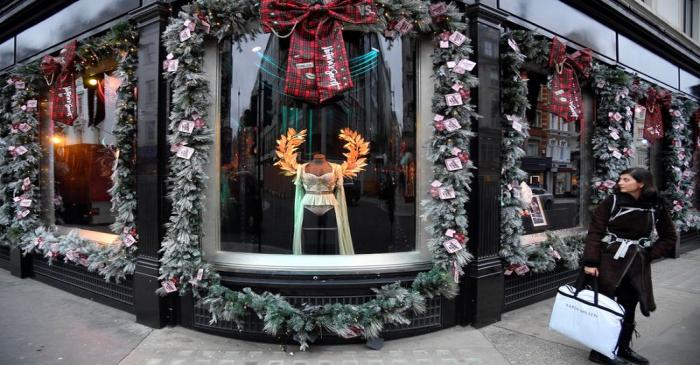 A woman views a Christmas seasonal display at a Victoria's Secret lingerie flagship store in