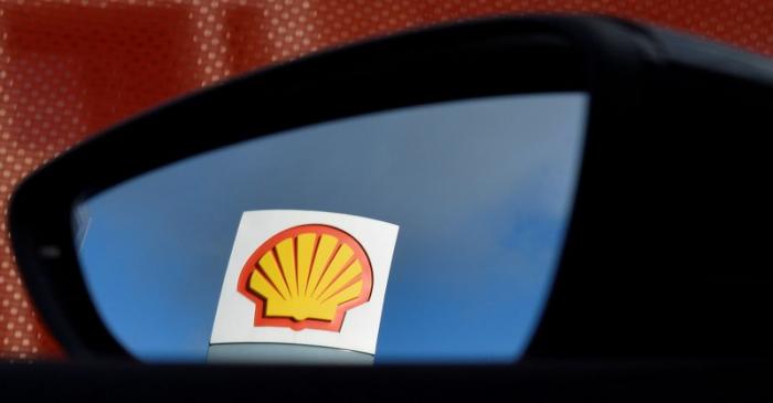 FILE PHOTO: A Shell logo is seen reflected in a car's side mirror at a petrol station in west