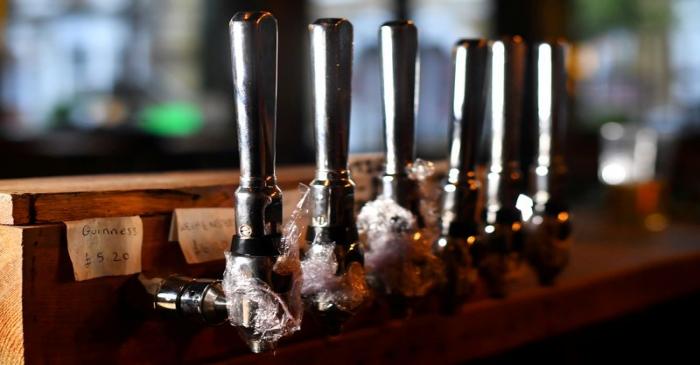 FILE PHOTO: Some beer taps are covered at The Prince in London