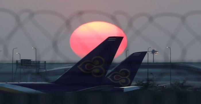 Thai Airways airplanes are parked at the tarmac of Suvarnabhumi Airport in Bangkok