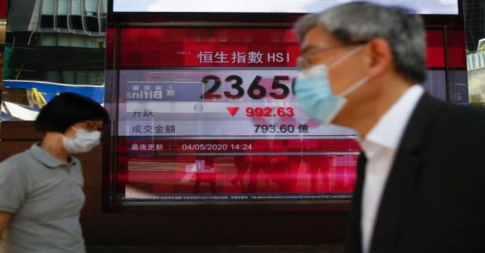 A panel displays the Hang Seng Index during afternoon trading, in Hong Kong