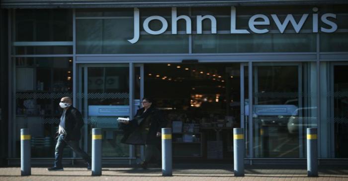 FILE PHOTO: A man wearing a protective mask leaves a John Lewis store as the company announces