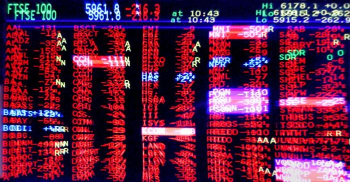 FILE PHOTO: London trading screen shows market slump