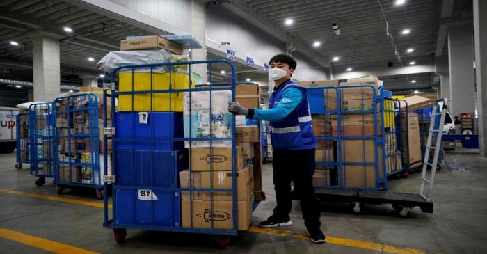 FILE PHOTO: A delivery man for Coupang Jung Im-hong wearing a mask to prevent contracting the