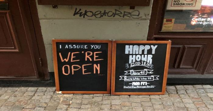 FILE PHOTO: Sign assures people that bar is open during coronavirus outbreak in Stockholm