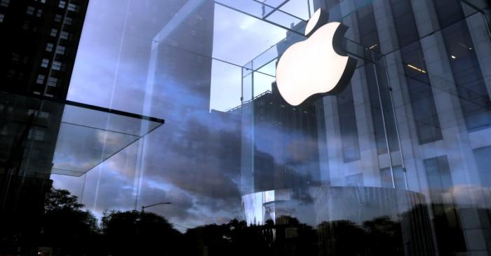 FILE PHOTO: The Apple Inc. logo is seen hanging at the entrance to the Apple store on 5th