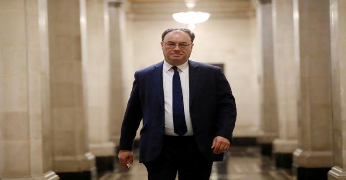 FILE PHOTO: Bank of England Governor Andrew Bailey poses for a photograph on the first day of