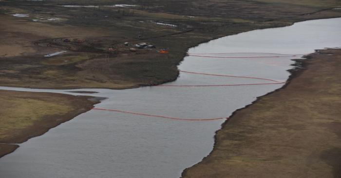 An aerial view shows a camp of rescuers and containment booms installed at the site of a huge