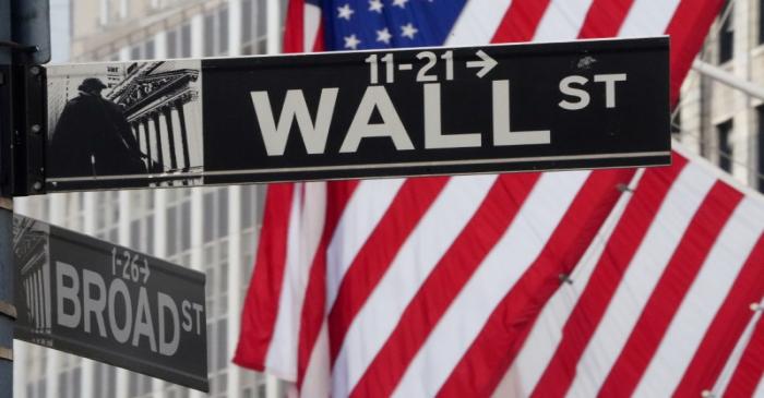 FILE PHOTO: FILE PHOTO: The Wall Street sign is pictured at the New York Stock exchange (NYSE)