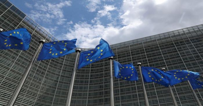 European Union flags flutter outside the European Commission headquarters in Brussels