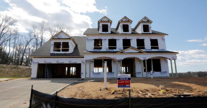 FILE PHOTO: A home under construction stands behind a 