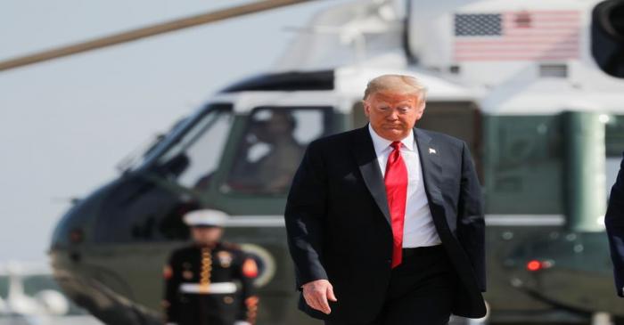 President Trump boards Air Force One as he departs on a day trip to Arizona from Washington