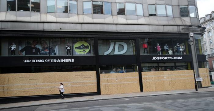 FILE PHOTO: Shops are seen boarded up in Oxford Street, in London