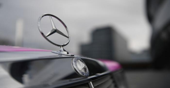 FILE PHOTO: The Mercedes-Benz logo is seen on a car in front of the Mercedes-Benz Museum in