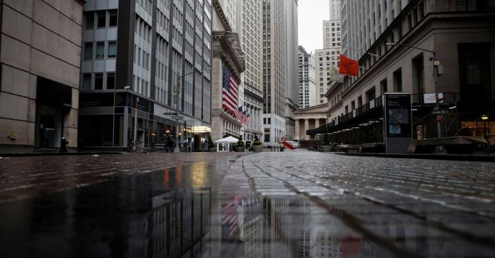 A view of a nearly deserted Broad street and and the New York Stock Exchange in the financial