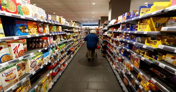 FILE PHOTO: Full shelves with groceries are pictured in a supermarket during the spread of the