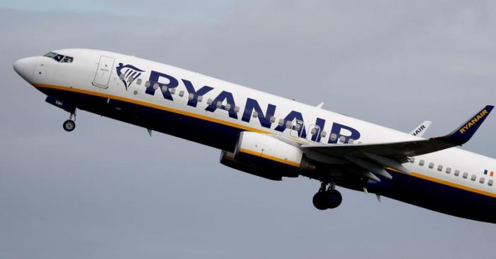 A Ryanair plane takes off from Manchester Airport as the spread of the coronavirus disease