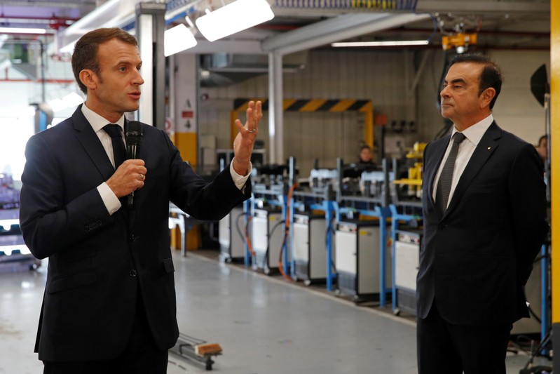 French President Emmanuel Macron and Carlos Ghosn, CEO of French car maker Renault, visit the