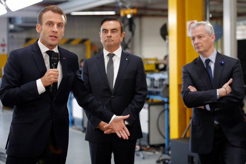 French President Emmanuel Macron and Carlos Ghosn, CEO of French car maker Renault, visit the