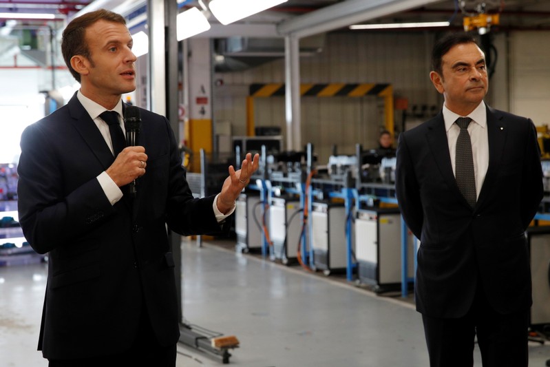 French President Emmanuel Macron and Carlos Ghosn, CEO of French car maker Renault, visit the