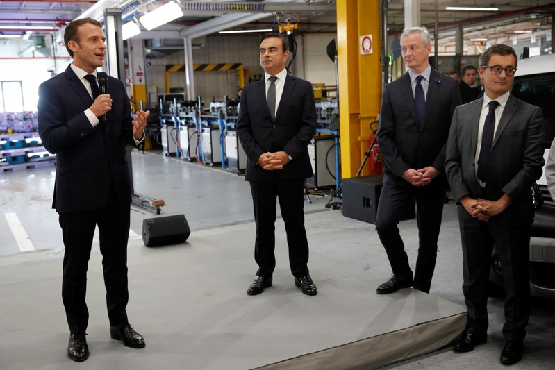 French President Emmanuel Macron and Carlos Ghosn, CEO of French car maker Renault, visit the