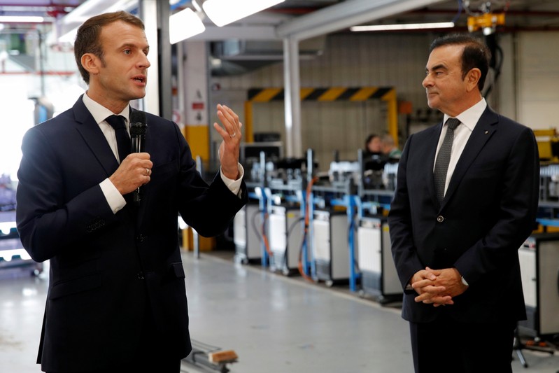 French President Emmanuel Macron and Carlos Ghosn, CEO of French car maker Renault, visit the