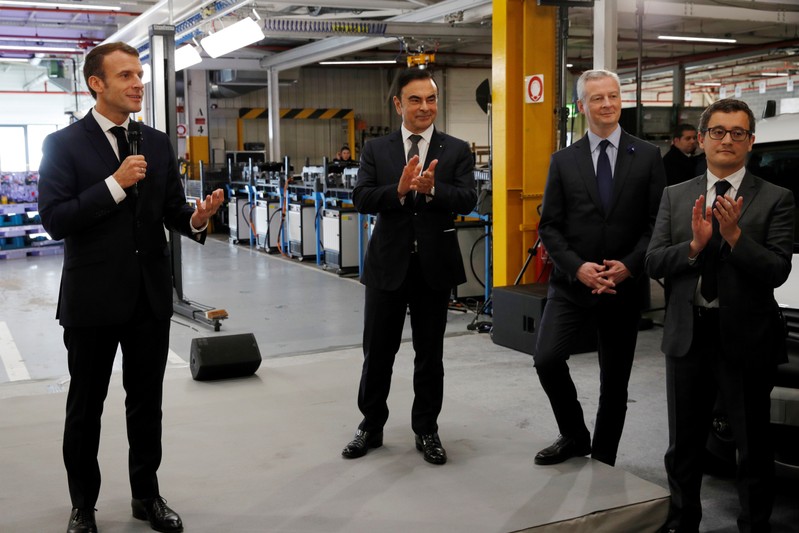 French President Emmanuel Macron and Carlos Ghosn, CEO of French car maker Renault, visit the