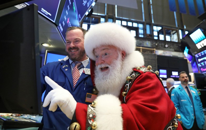 FILE PHOTO: Santa Claus pays a visit on the floor at the New York Stock Exchange (NYSE) in New