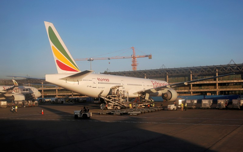 FILE PHOTO: Workers service an Ethiopian Airlines plane at the Bole International Airport in