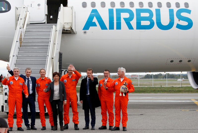 FILE PHOTO: Pilots celebrate with Guillaume Faury, President of Airbus Commercial Aircraft,