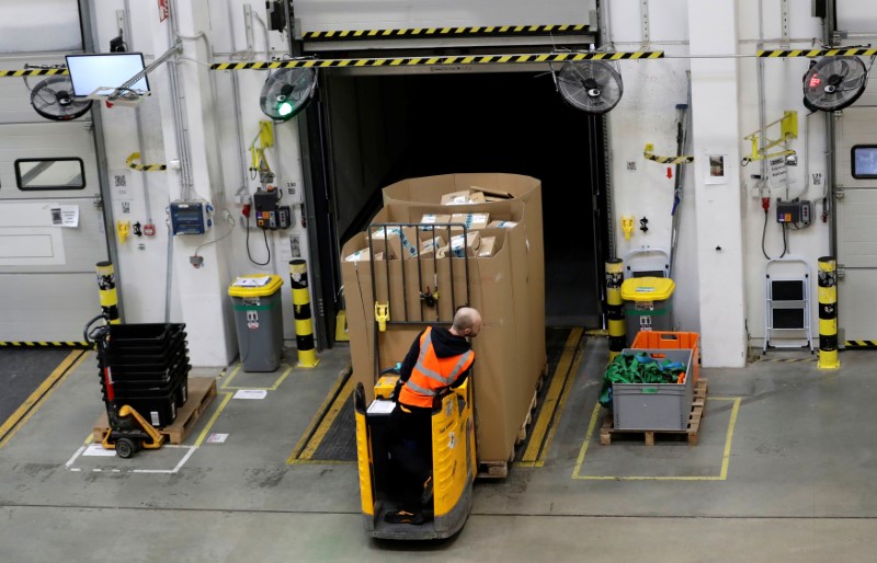 An employee works at the Amazon fulfillment center in the village of Dobroviz, near Prague