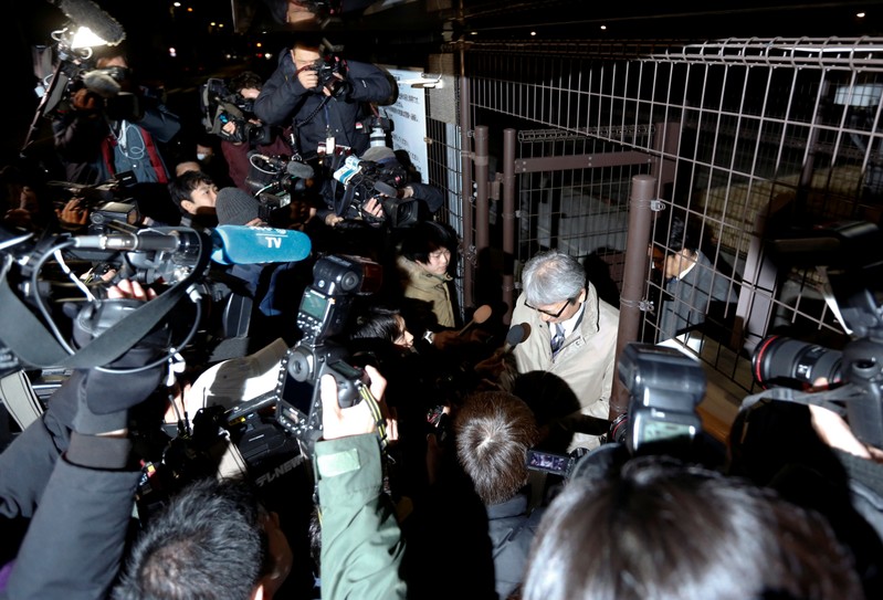 Motonari Otsuru, lawyer of Nissan's arrested chairman Carlos Ghosn, is surrounded by media as