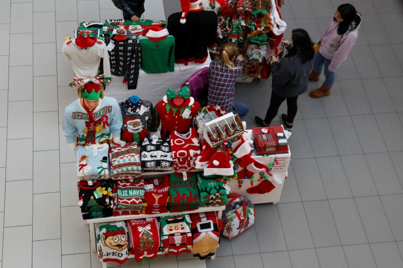 People shop for holiday-themed gifts at Roosevelt Field mall in Garden City