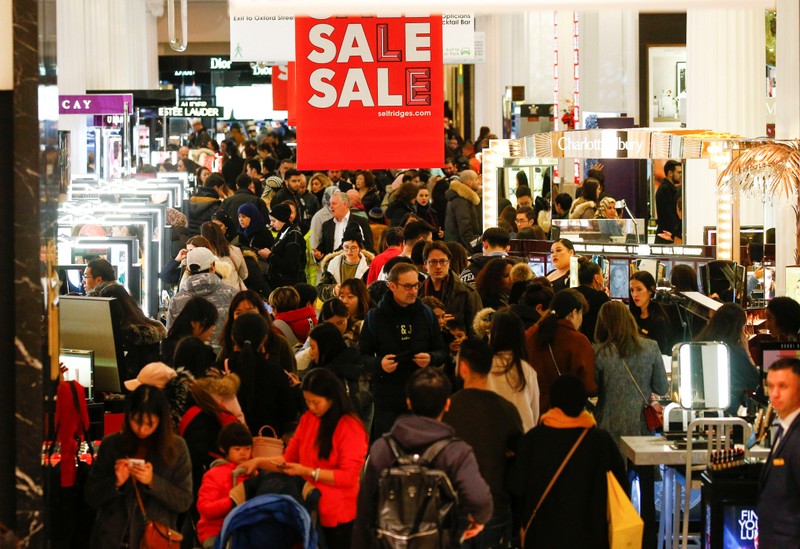 Shoppers are seen inside the Selfridges store on Oxford Street during the Boxing Day sales in