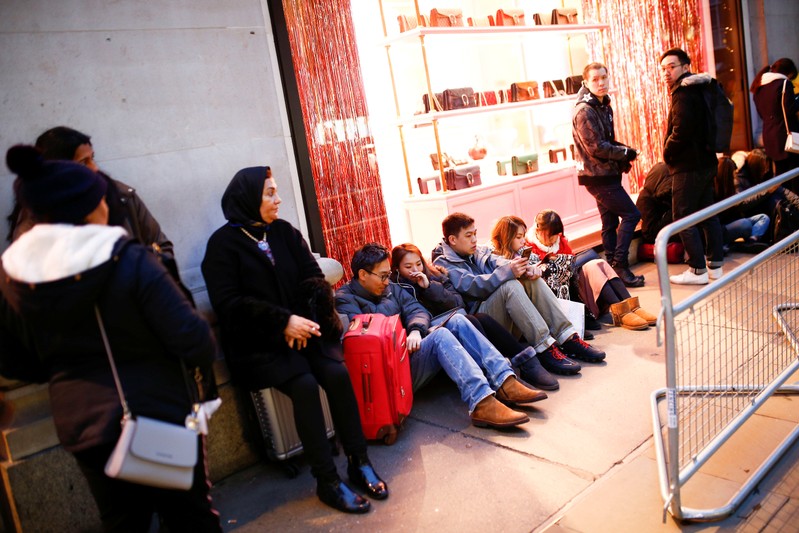 Shoppers queue outside for the Boxing Day sales at Selfridges in Oxford Street in central