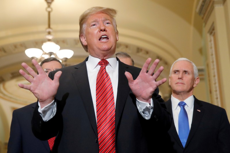 FILE PHOTO: President Trump talks to reporters after addressing closed Senate Republican policy