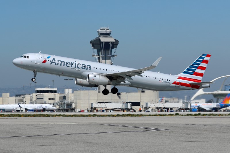 FILE PHOTO: An American Airlines Airbus A321 plane takes off from Los Angeles International