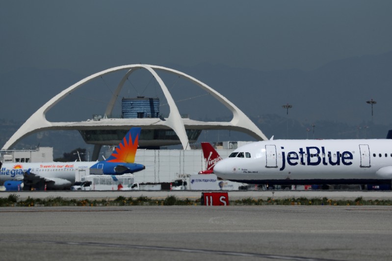 A Jet Blue airplane is seen at Los Angeles International airport